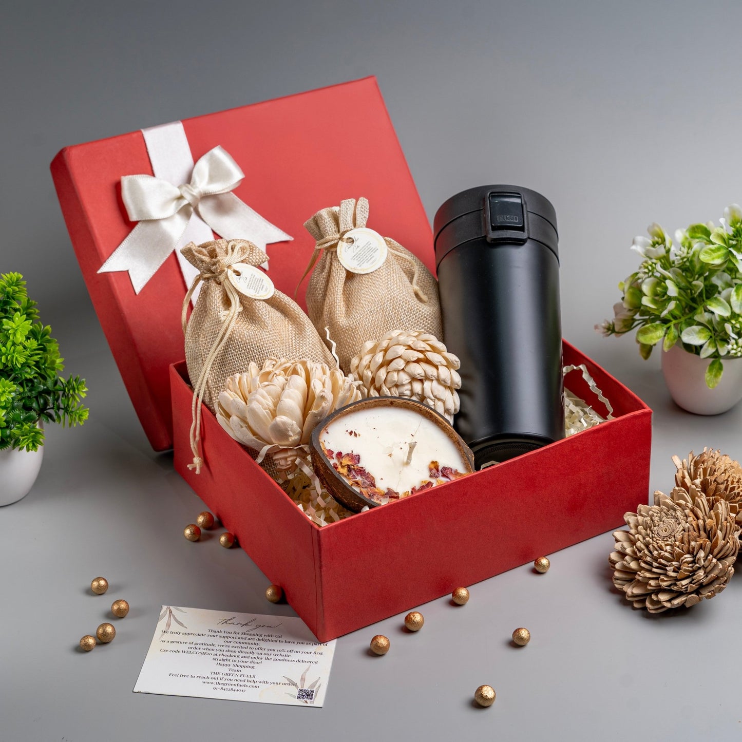 Soulful treat box gift hamper with roasted nuts, coconut shell candle and coffee mug by The Green Fuels