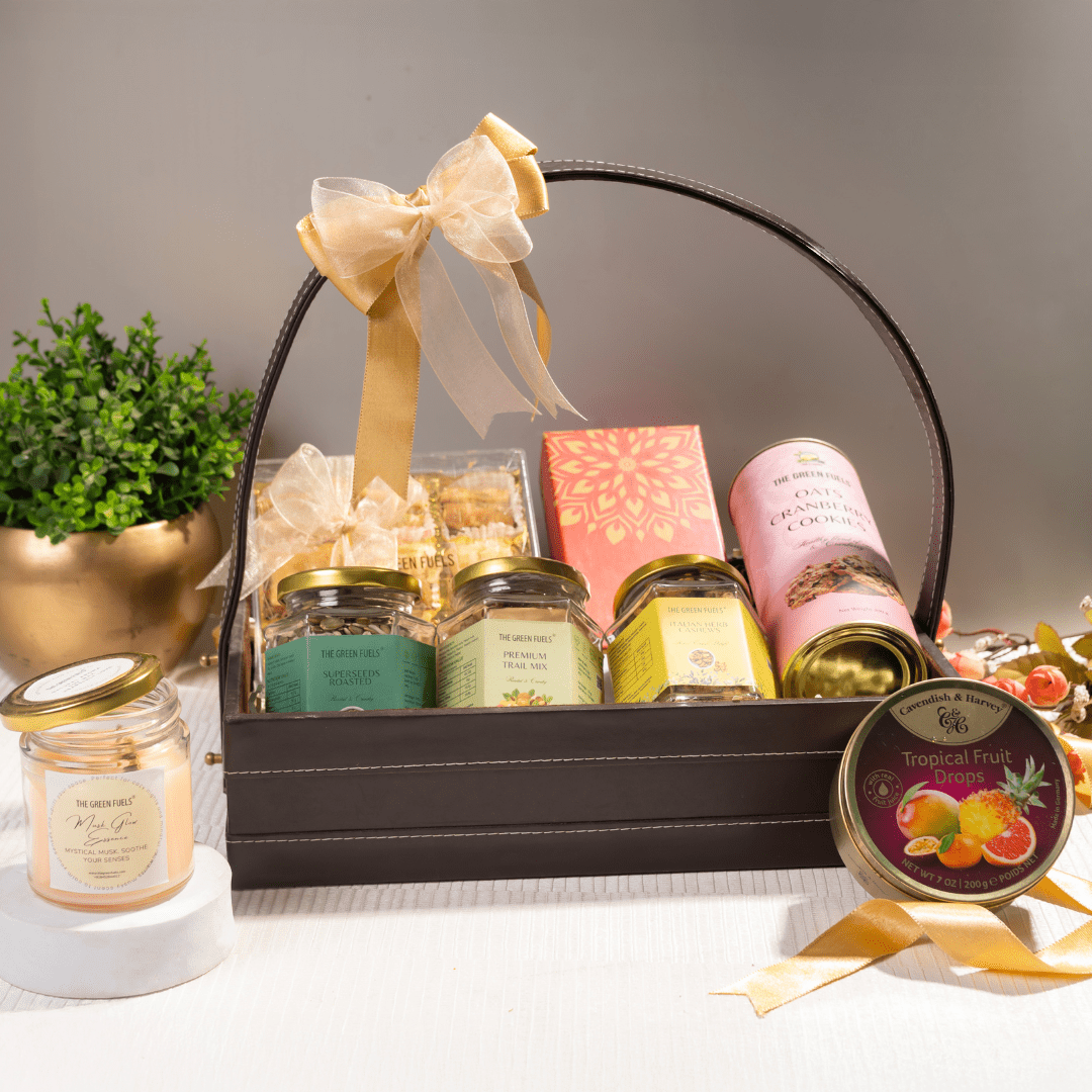 Luxe voyager basket gift hamper with Turkish baklava herb cashews Moroccan mint tea and scented candle by TGF